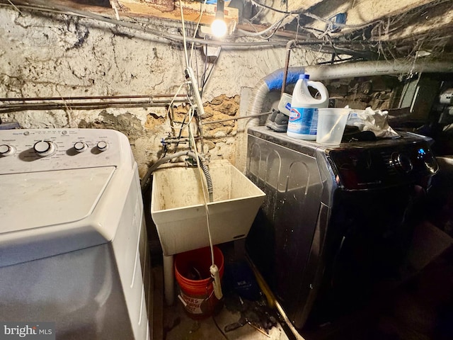 laundry room featuring sink and washer / clothes dryer