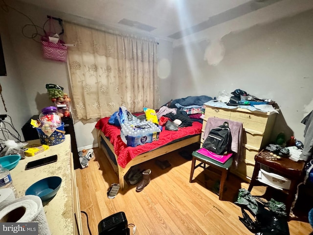 bedroom featuring wood-type flooring