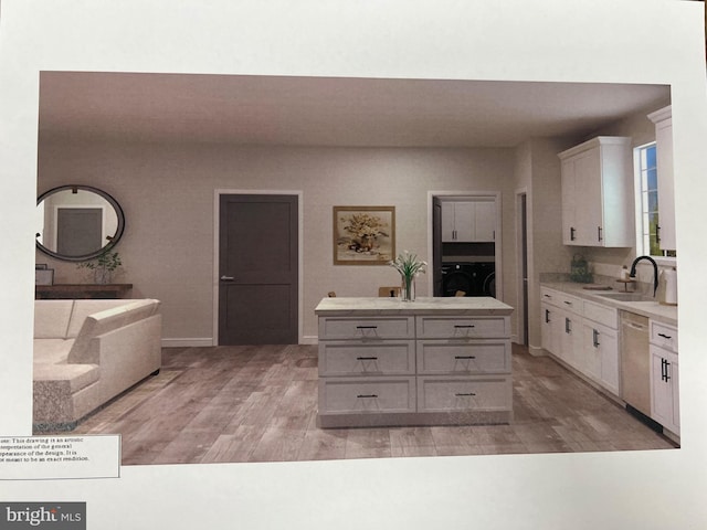 kitchen featuring a sink, dishwasher, light countertops, and washer and clothes dryer