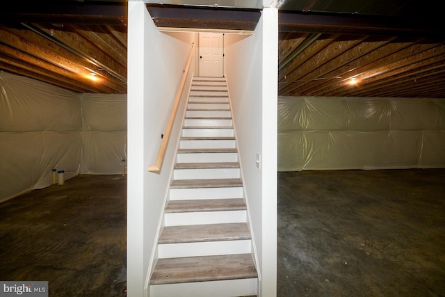 stairs with concrete floors
