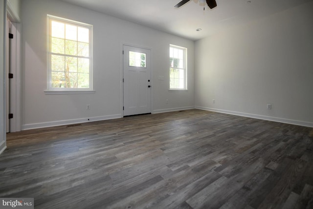entrance foyer featuring a ceiling fan, baseboards, and dark wood-style flooring