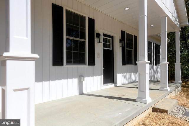 view of exterior entry with covered porch
