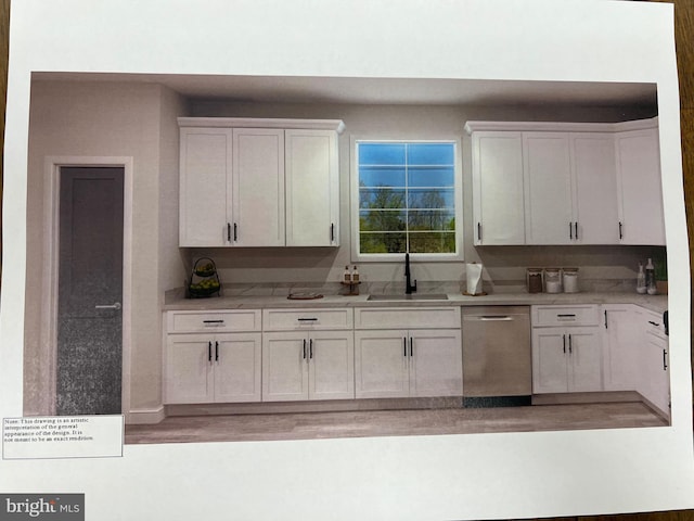 kitchen featuring a sink, stainless steel dishwasher, and white cabinetry