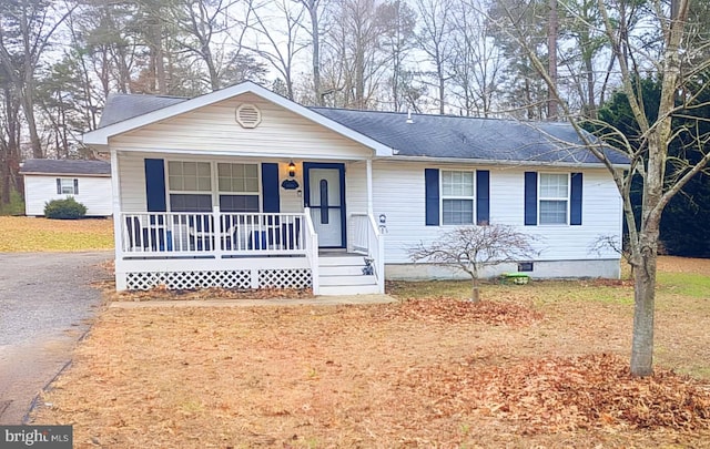 ranch-style house with covered porch