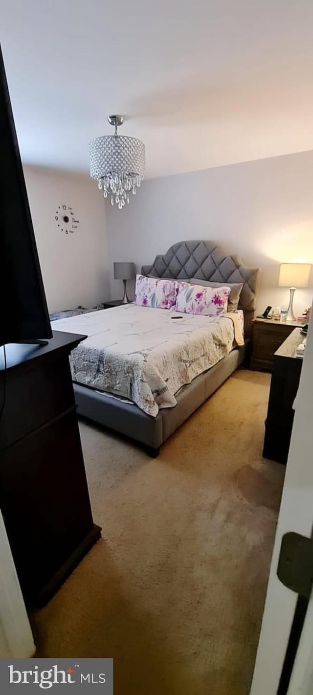 6689 Mackall, Saint Leonard, MD 20685 - carpeted bedroom with an inviting chandelier
