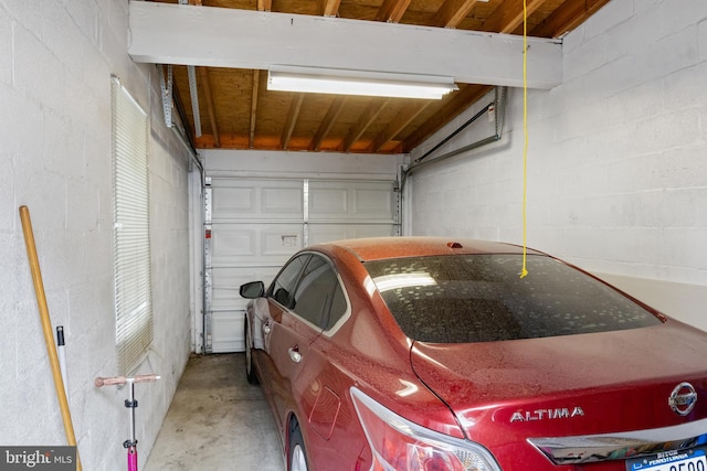 garage with concrete block wall