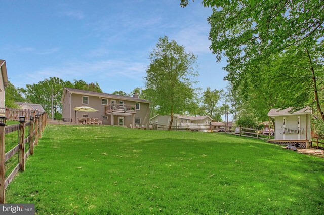 view of yard with a fenced backyard and a wooden deck
