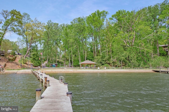 dock area with a gazebo and a water view