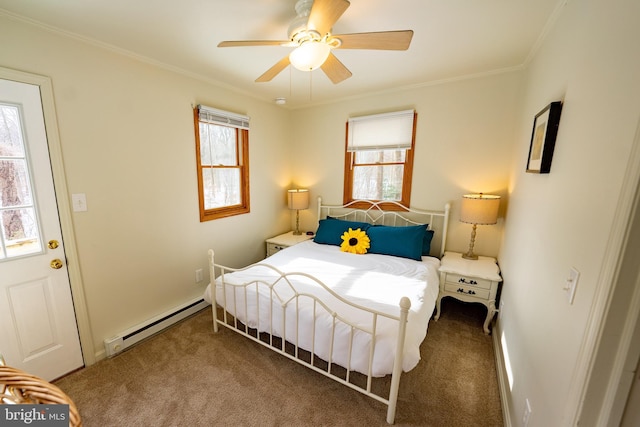 bedroom featuring a baseboard heating unit, ornamental molding, carpet flooring, and ceiling fan