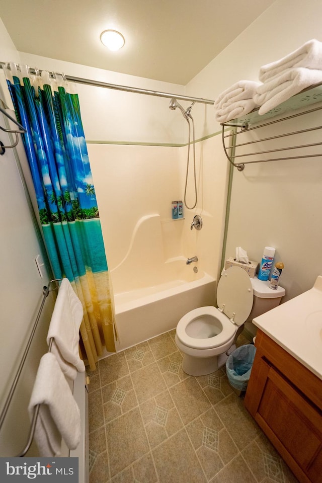 full bathroom with vanity, tile patterned flooring, toilet, and shower / bath combo with shower curtain