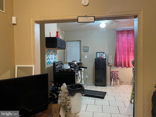 home office with light tile patterned floors and visible vents