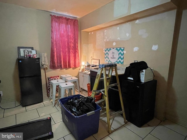 miscellaneous room with light tile patterned floors