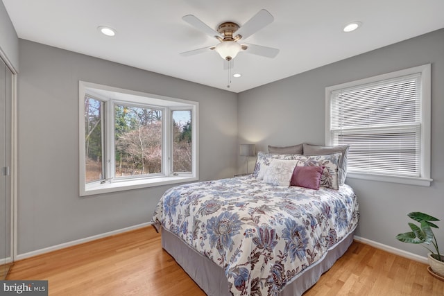 bedroom featuring light wood-type flooring and ceiling fan