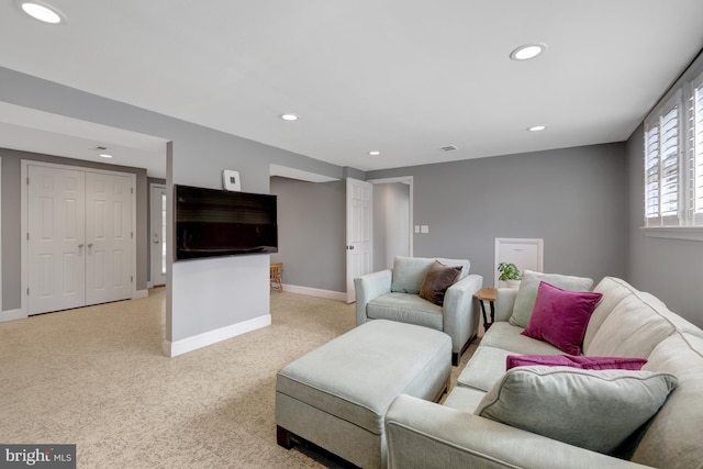 living room featuring light carpet