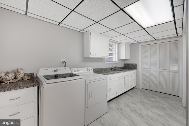 laundry room with sink, cabinets, and independent washer and dryer