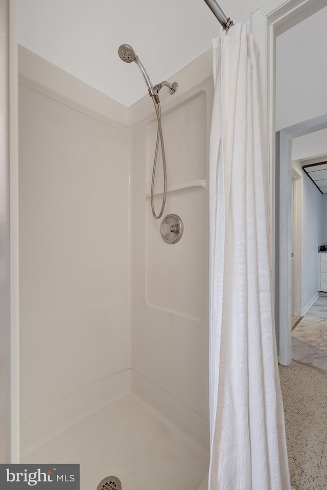 bathroom with a shower with curtain