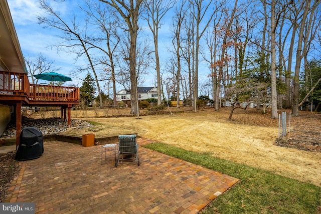 view of yard with a patio and a wooden deck