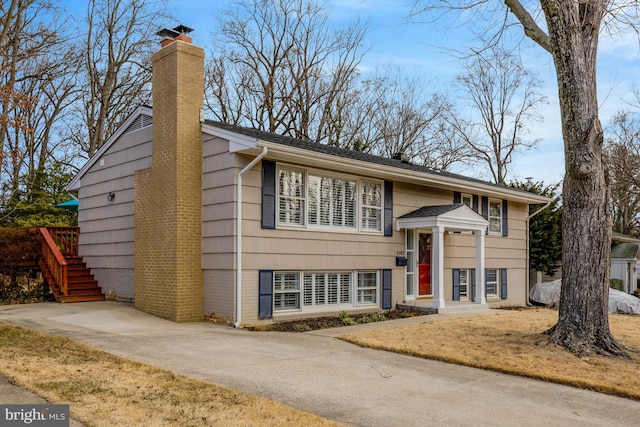 raised ranch with a front lawn