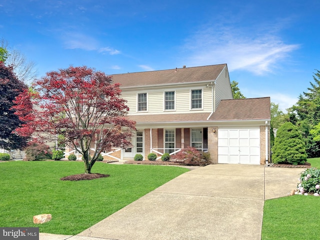 10628 Democracy Ln, Potomac, MD 20854 - view of front of house with driveway, an attached garage, a front lawn, and covered porch