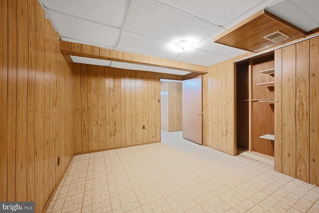 10628 Democracy Ln, Potomac, MD 20854 - finished below grade area featuring wooden walls, tile patterned floors, a paneled ceiling, and baseboards