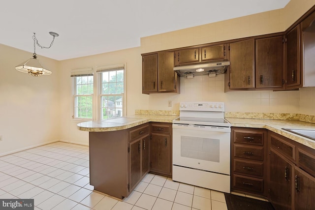 10628 Democracy Ln, Potomac, MD 20854 - kitchen featuring electric stove, under cabinet range hood, a peninsula, and light countertops