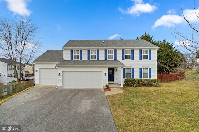 view of front of home featuring a garage, aphalt driveway, roof with shingles, fence, and a front lawn