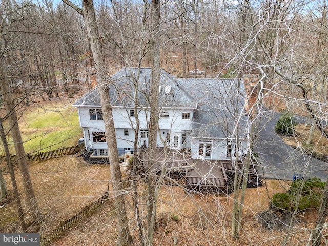 rear view of property with fence