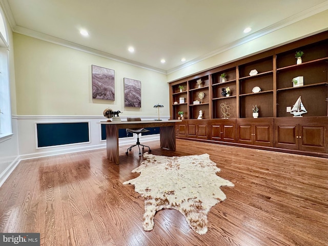 home office featuring a decorative wall, a wainscoted wall, recessed lighting, wood finished floors, and ornamental molding