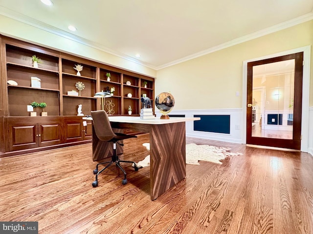 office space with light wood-type flooring, a wainscoted wall, ornamental molding, and recessed lighting