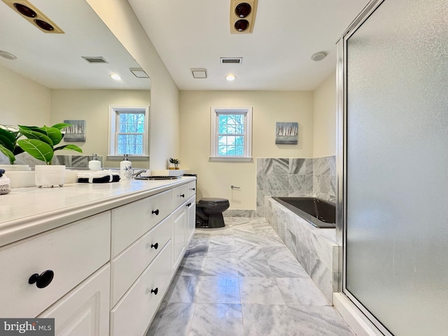 full bath featuring toilet, visible vents, a bath, and vanity