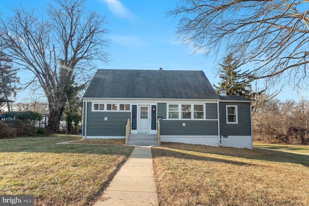 view of front of home with a front yard