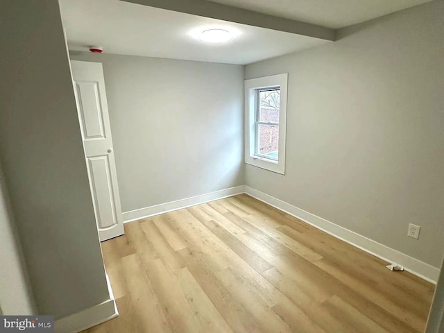 unfurnished room with light hardwood / wood-style flooring