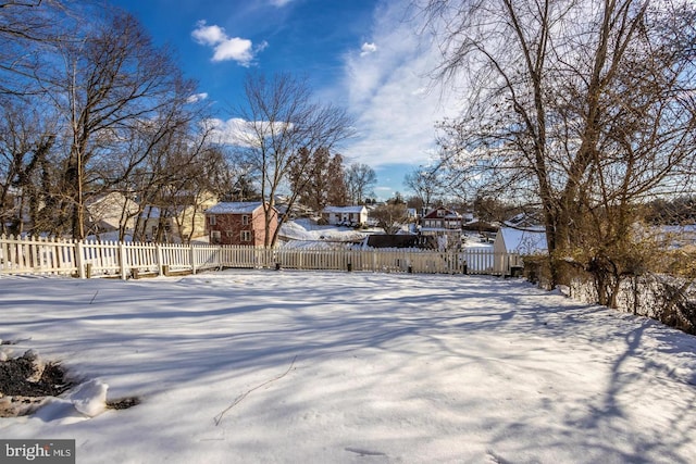 view of yard covered in snow