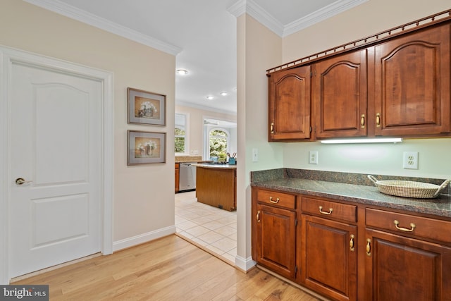 10928 Woodland Falls Dr, Great Falls, VA 22066 - kitchen with dishwasher, ornamental molding, light wood-style flooring, baseboards, and brown cabinets