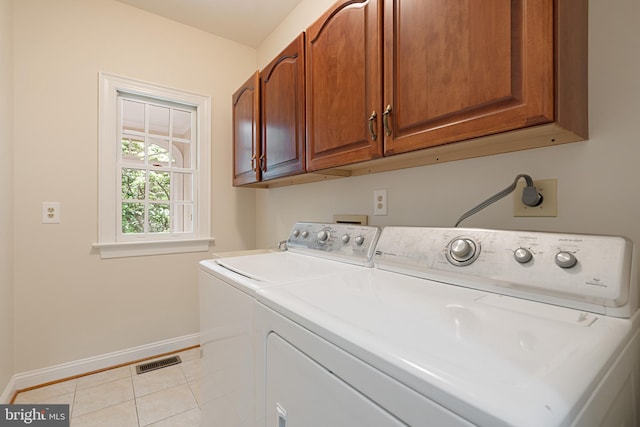10928 Woodland Falls Dr, Great Falls, VA 22066 - washroom with cabinet space, baseboards, independent washer and dryer, and light tile patterned floors