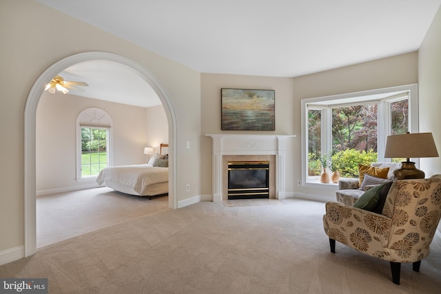10928 Woodland Falls Dr, Great Falls, VA 22066 - carpeted bedroom with a fireplace, arched walkways, and baseboards
