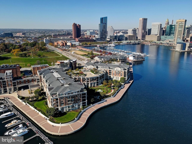 drone / aerial view with a view of city and a water view