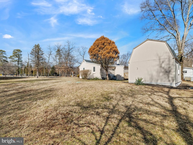 view of yard featuring an outbuilding and a barn