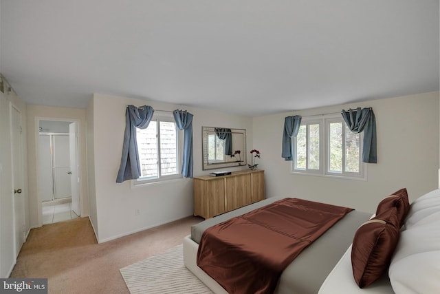 carpeted bedroom featuring baseboards