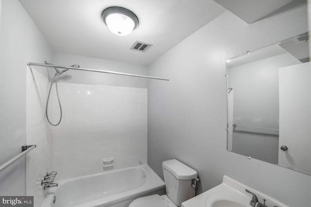 bathroom with toilet, visible vents, shower / washtub combination, and vanity