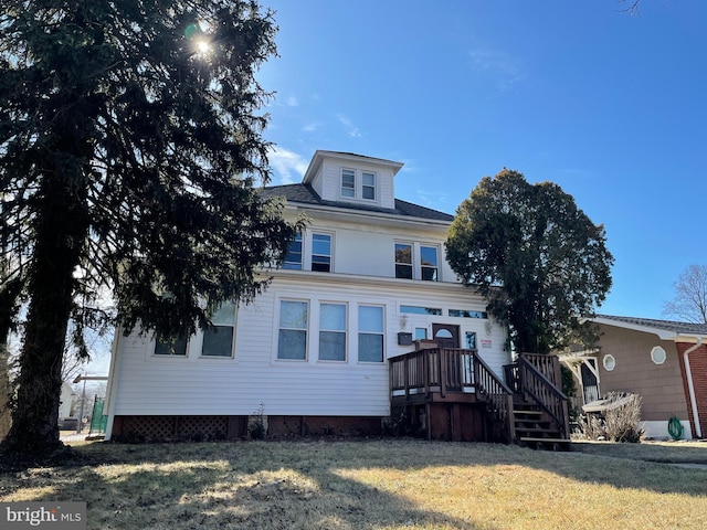 rear view of house with a yard