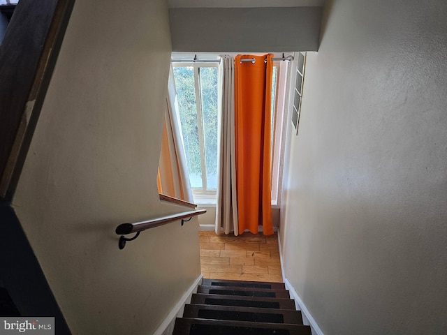 staircase featuring a wealth of natural light