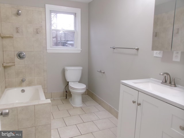 full bathroom with toilet, vanity, tile patterned flooring, and tiled shower / bath combo