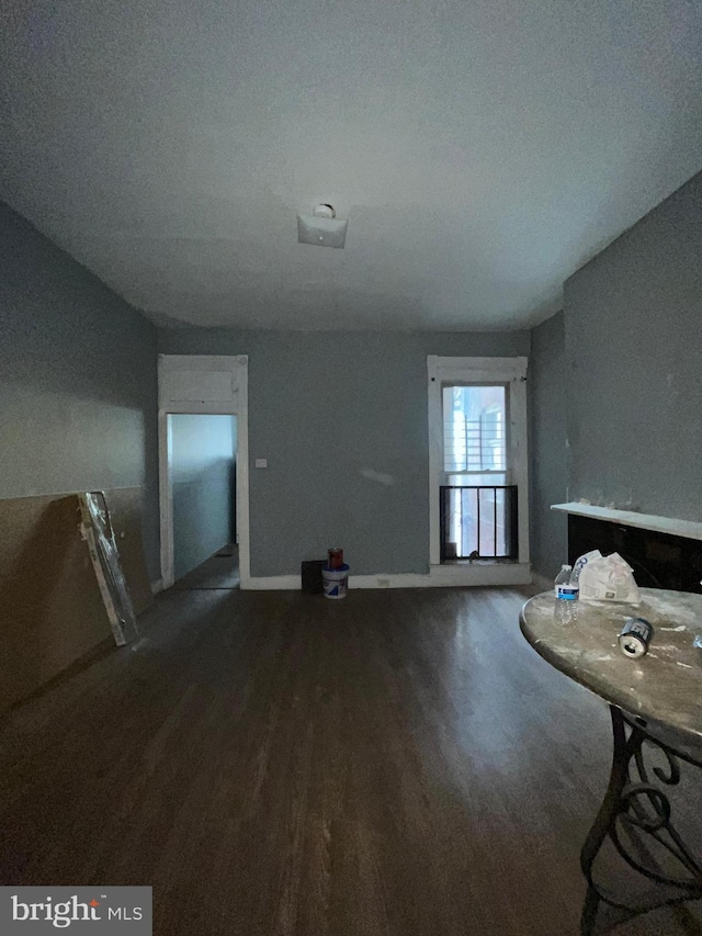 unfurnished living room featuring hardwood / wood-style flooring