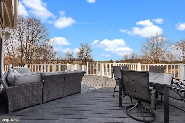 deck featuring an outdoor hangout area and outdoor dining space