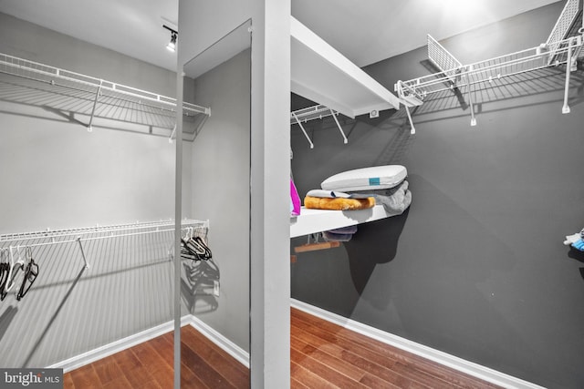 spacious closet with wood finished floors