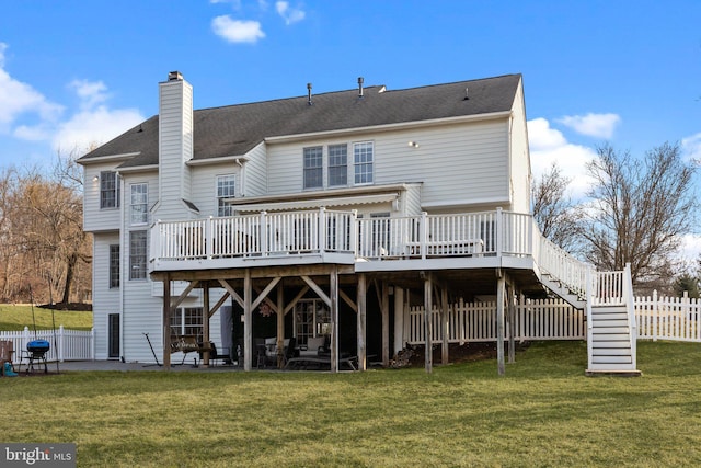 back of property with a yard, a chimney, a patio, and fence