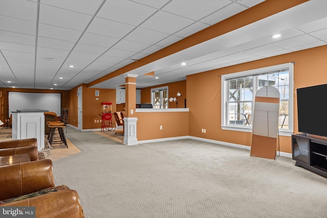 living room featuring recessed lighting, baseboards, carpet floors, and decorative columns