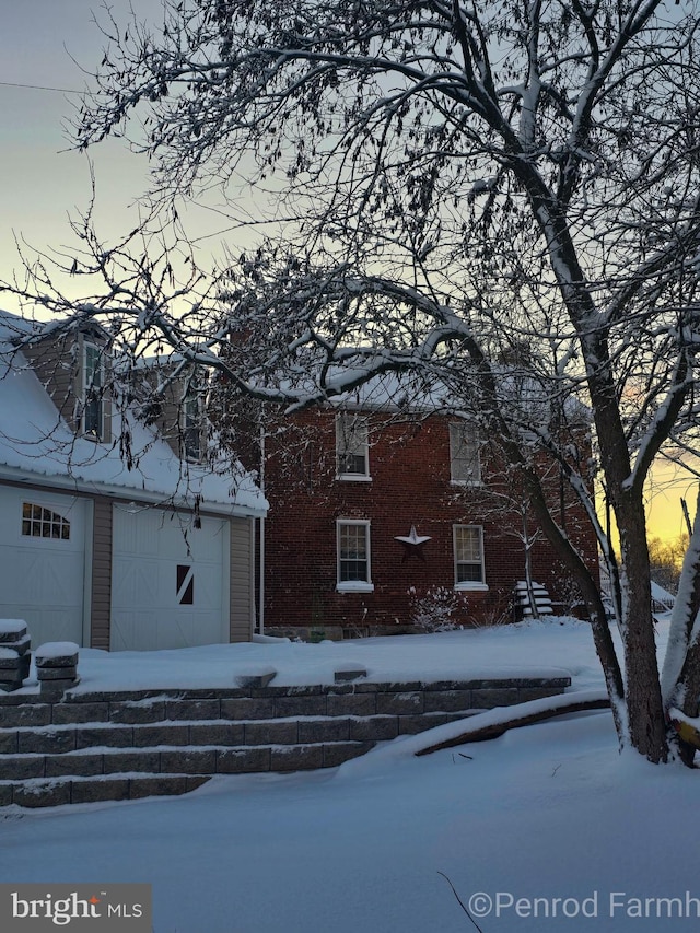 229 N Linden Ave N Unit 1, Greencastle, PA 17225 - view of snow covered exterior with a garage