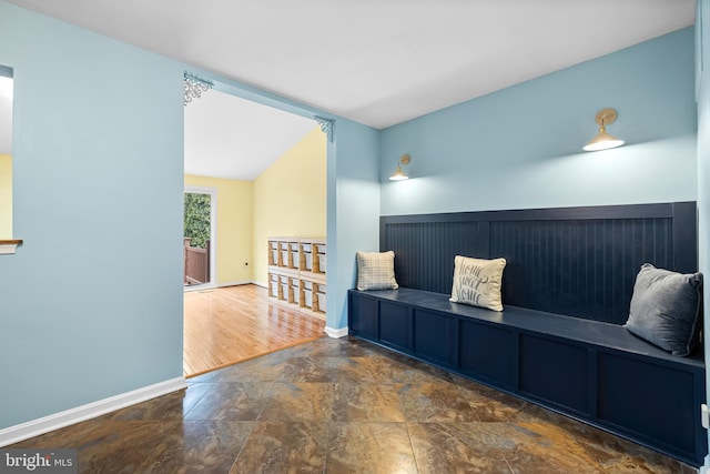 sitting room featuring vaulted ceiling